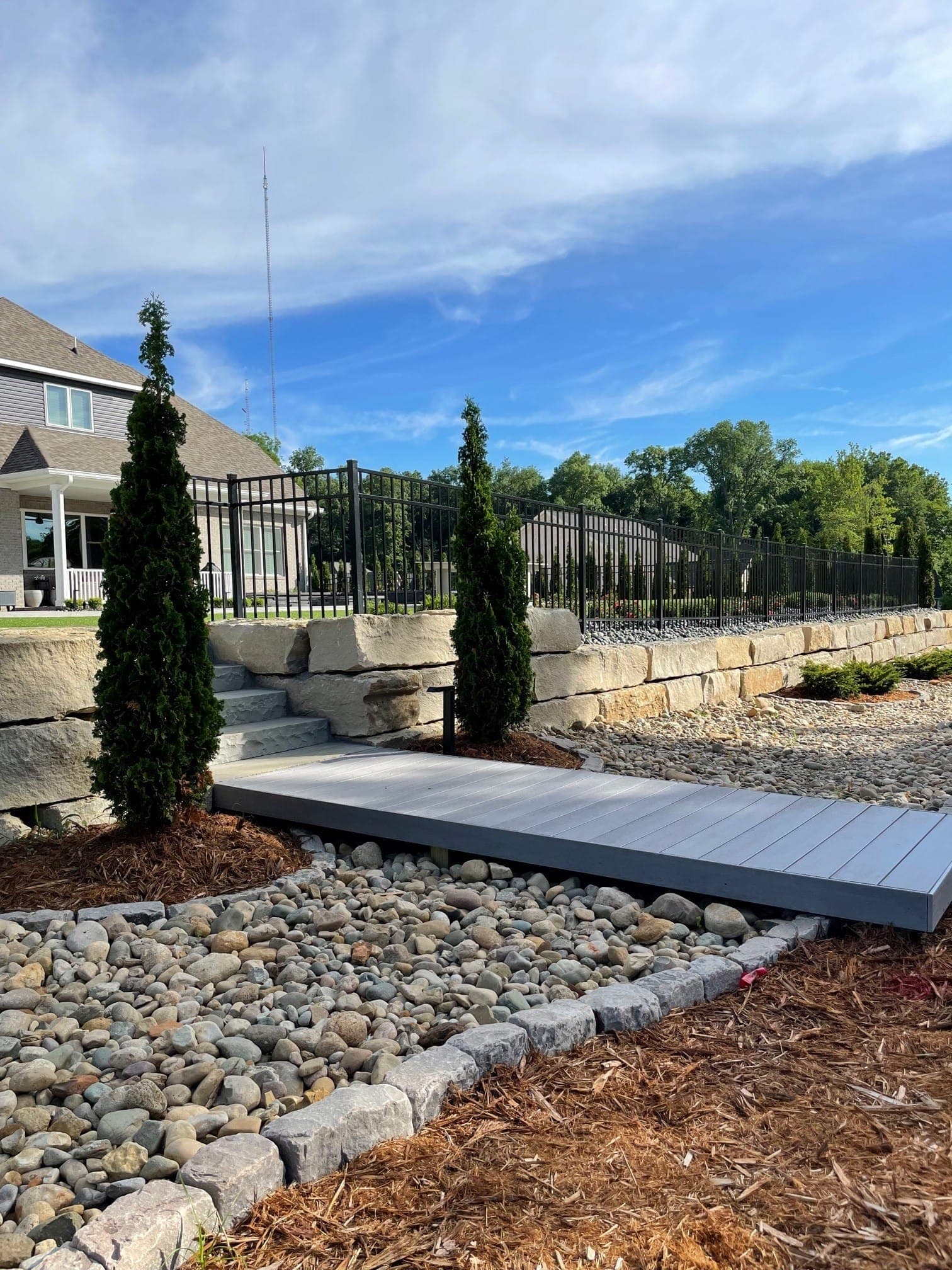 Custom stone walkway with border plantings